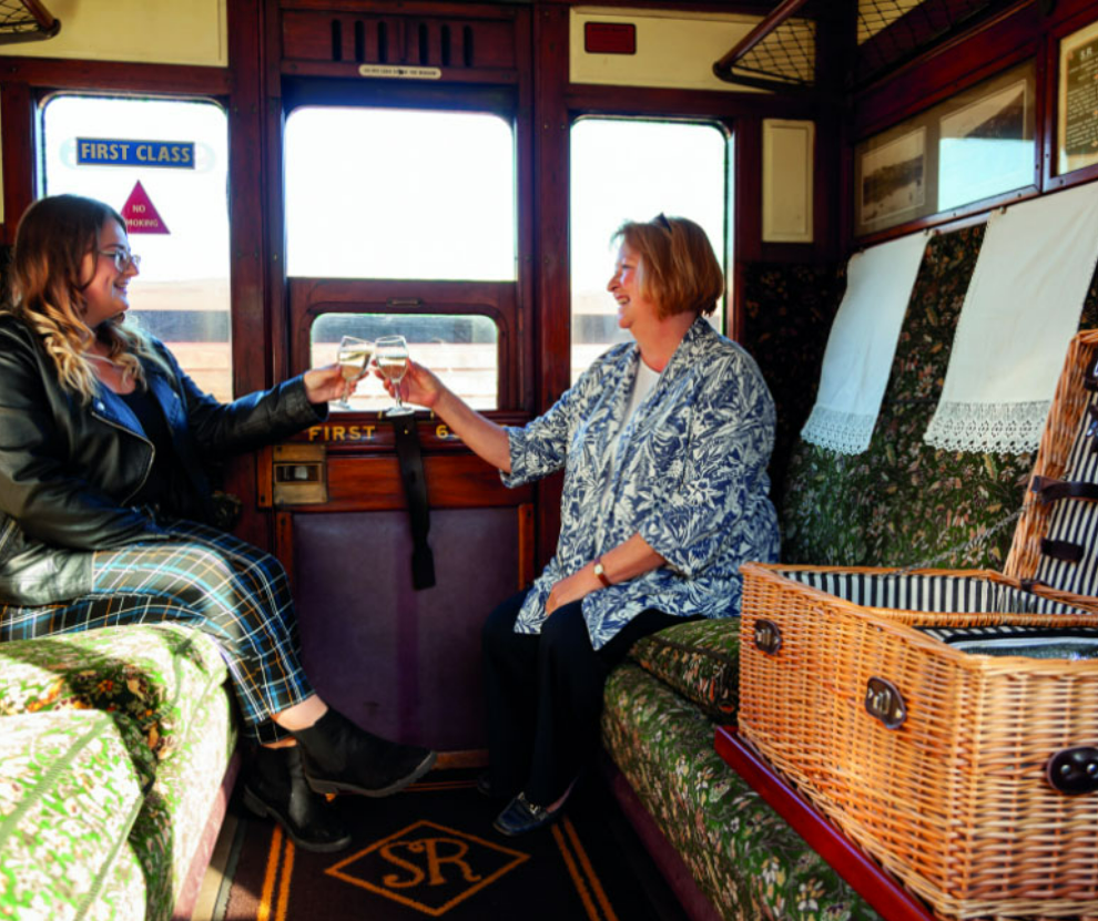 mothers day image in a train carriage with a food hamper